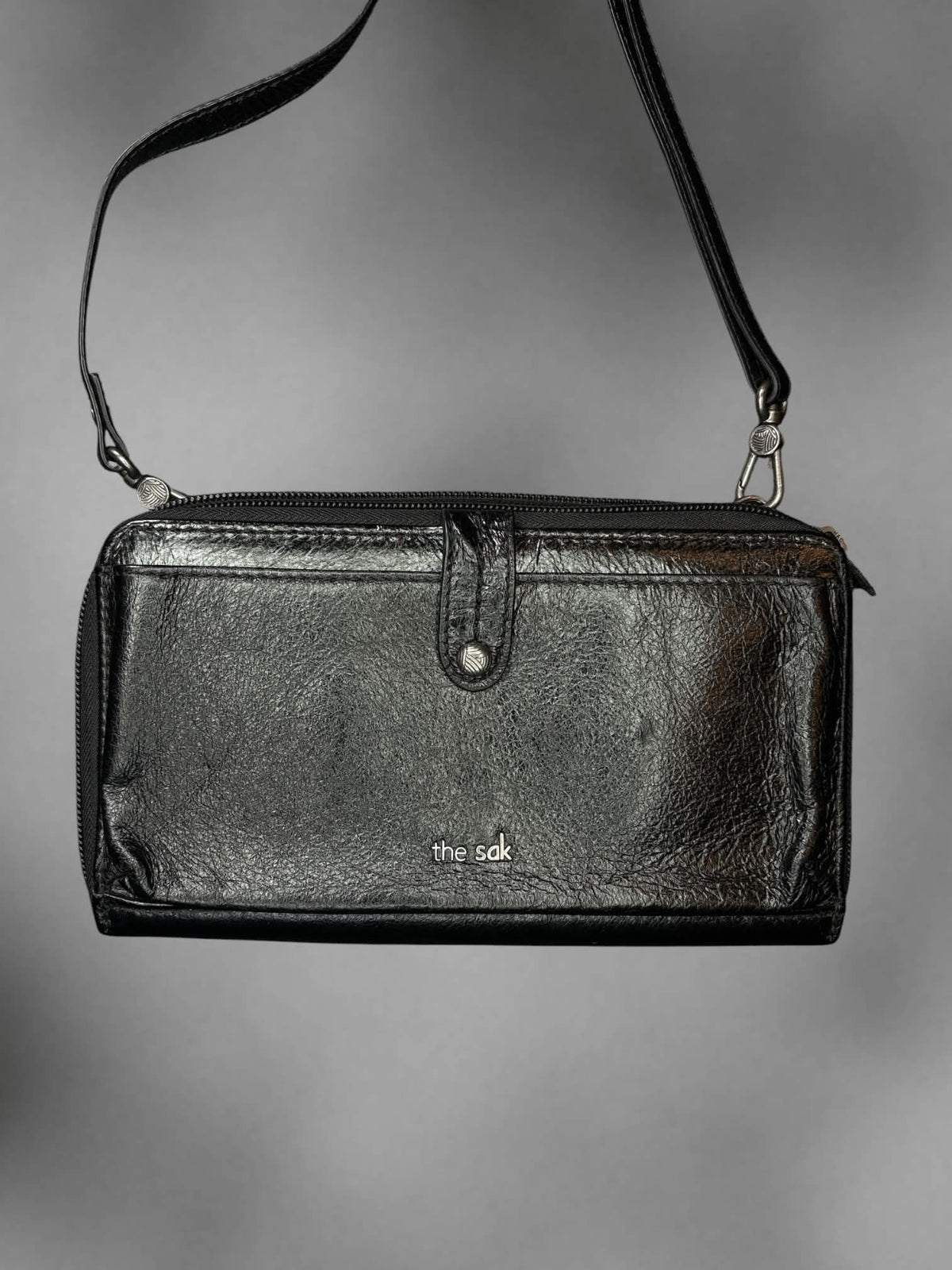 The Sak black faux leather shoulder bag with zipper pockets