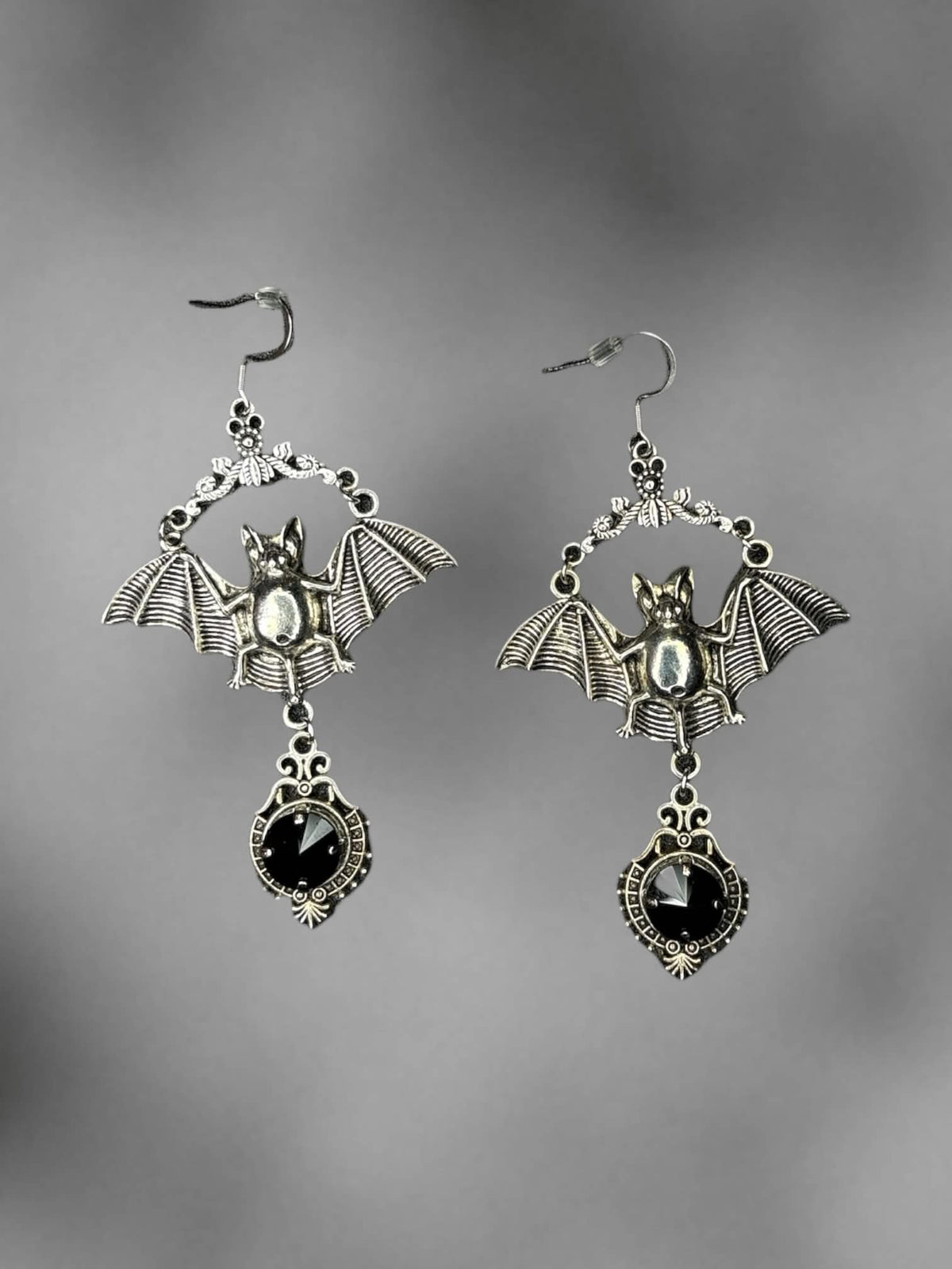Silver bat earrings with black stone charm