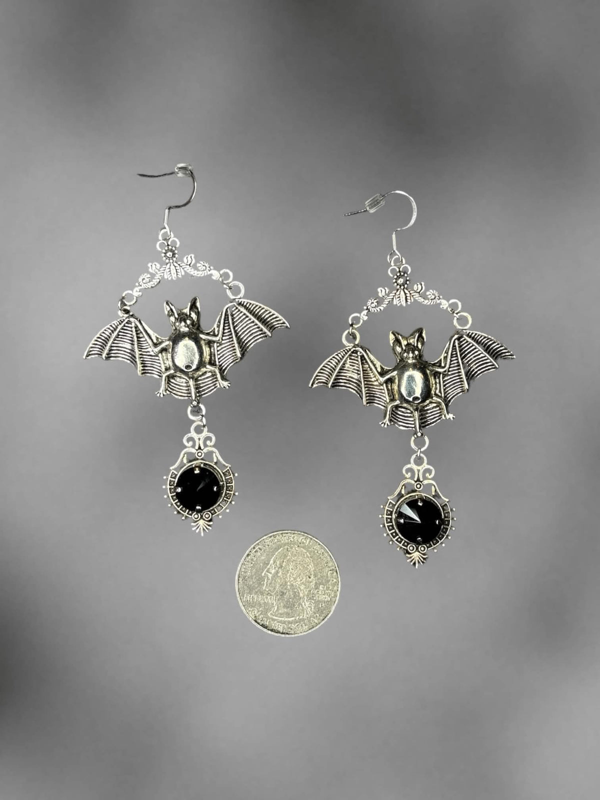 Silver bat earrings with black stone charm