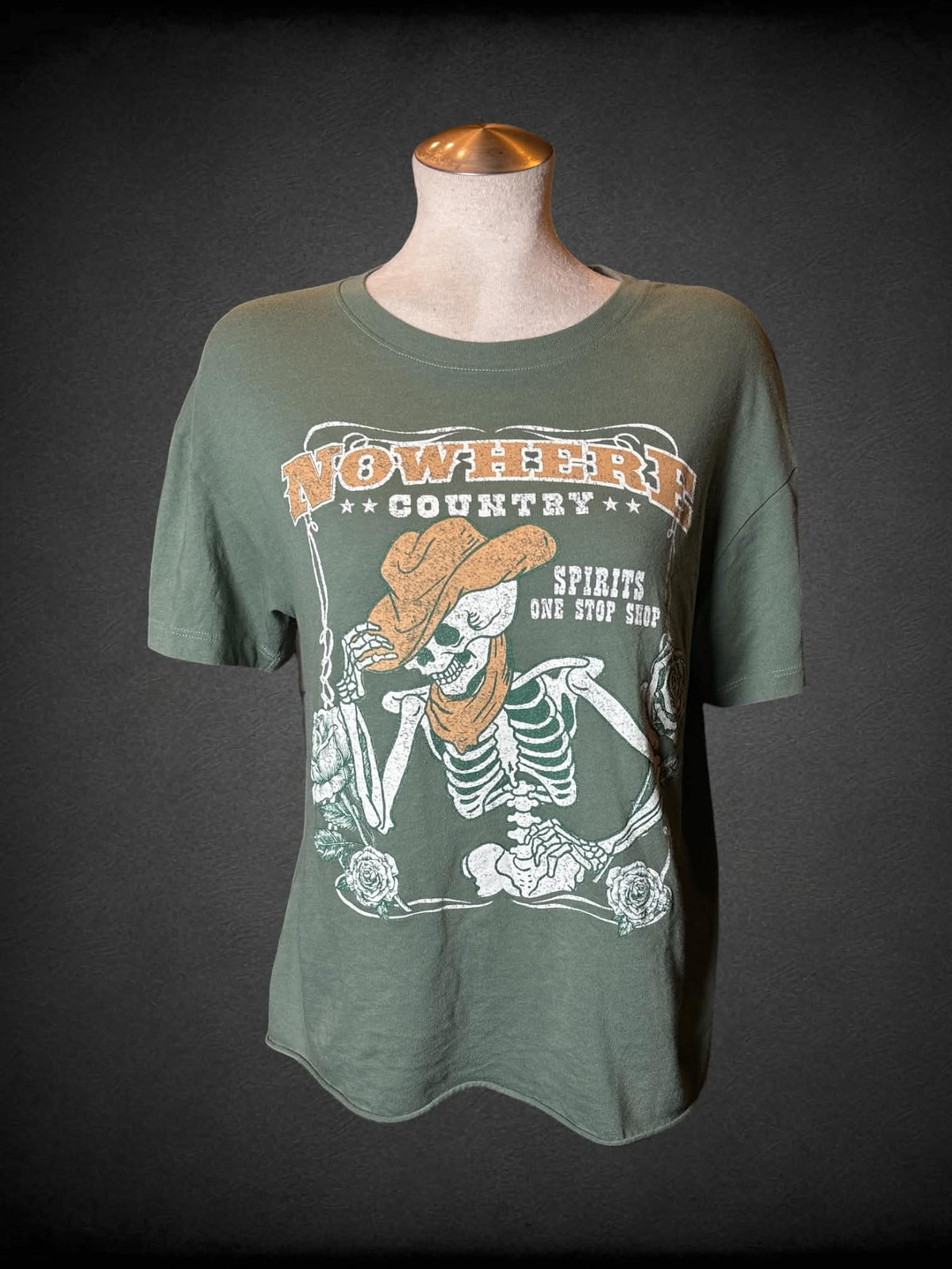 L Awake sage green t shirt with “Nowhere Country” cowboy skeleton on front