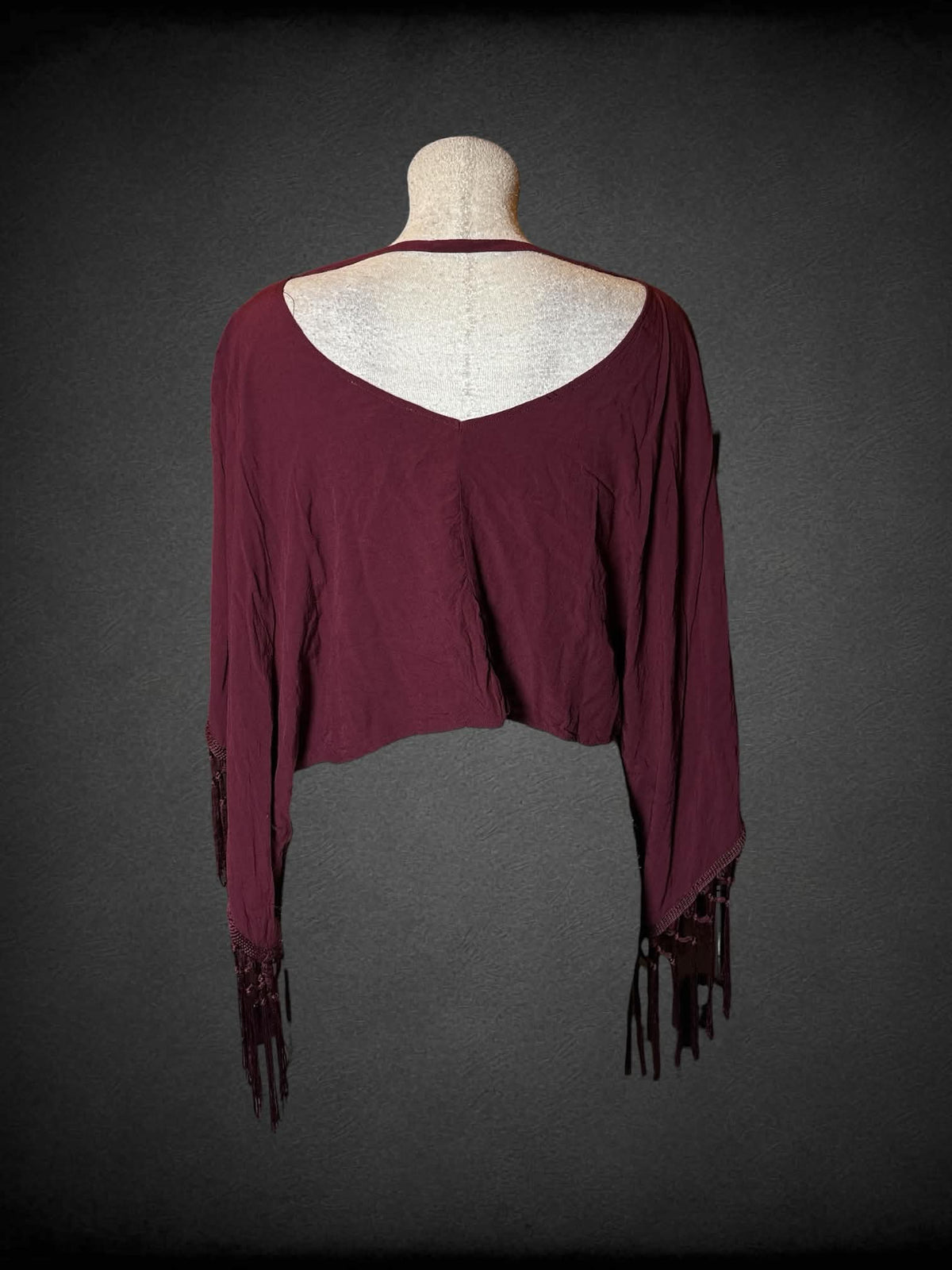 L Haute Society maroon cropped long-sleeve top with tassels on sleeves