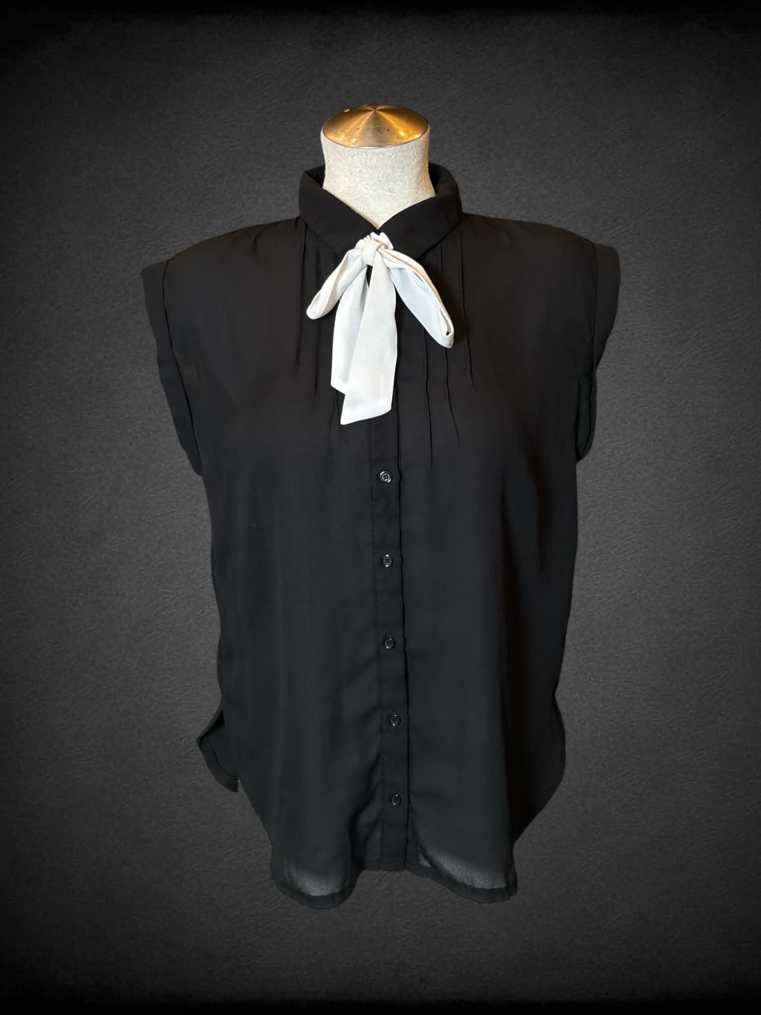 L Elodi black sheer button-up blouse with white sash around neck
