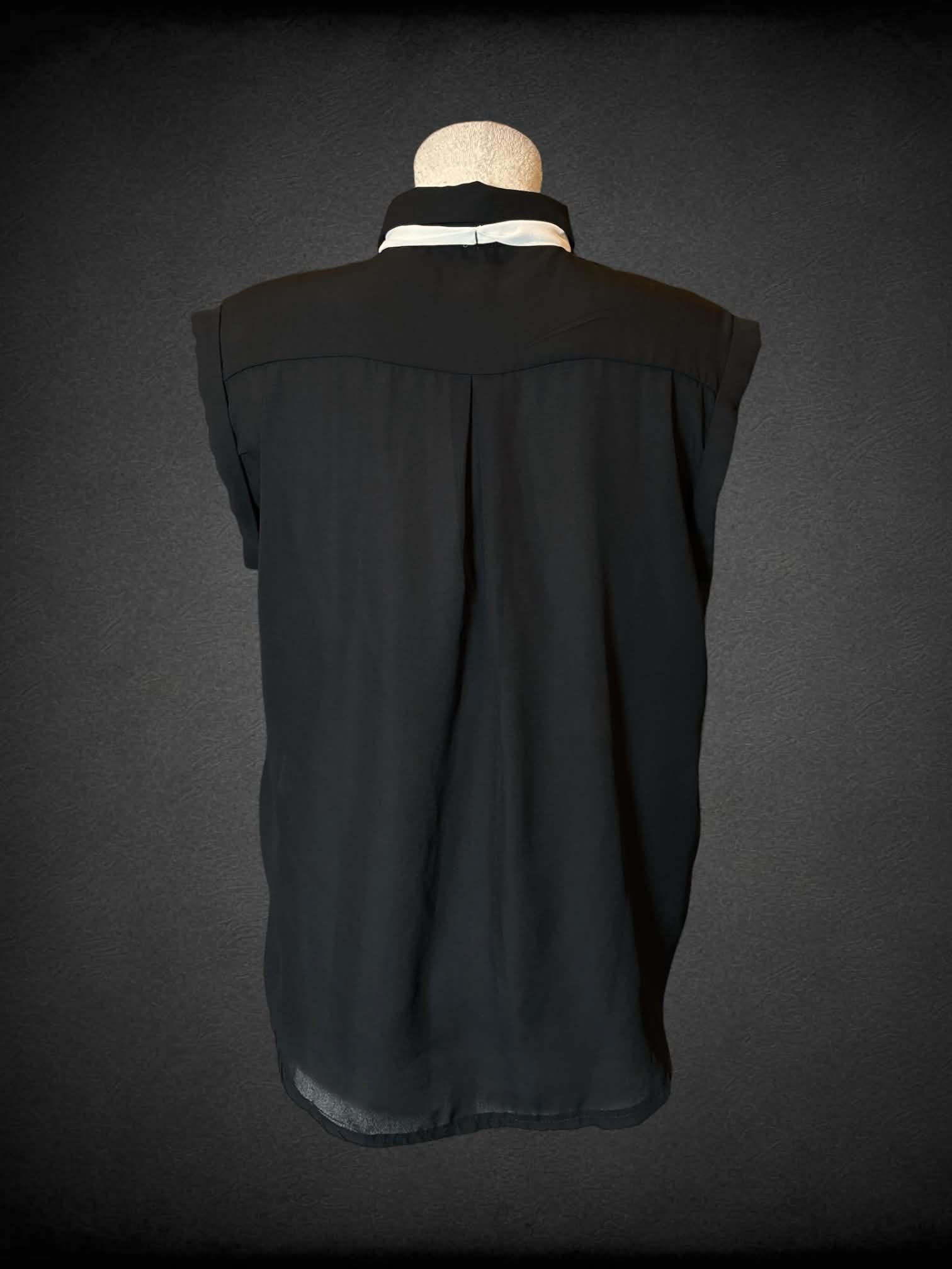 L Elodi black sheer button-up blouse with white sash around neck