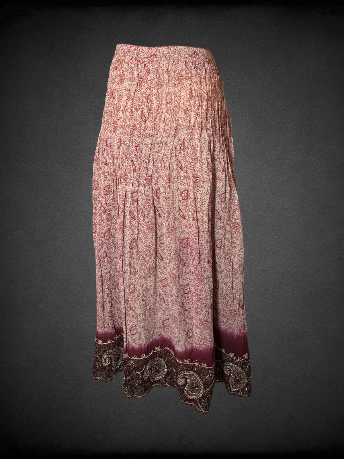 L Soft Surroundings beige pleated skirt with maroon paisley design, zipper and button on side, and sequined pattern on bottom