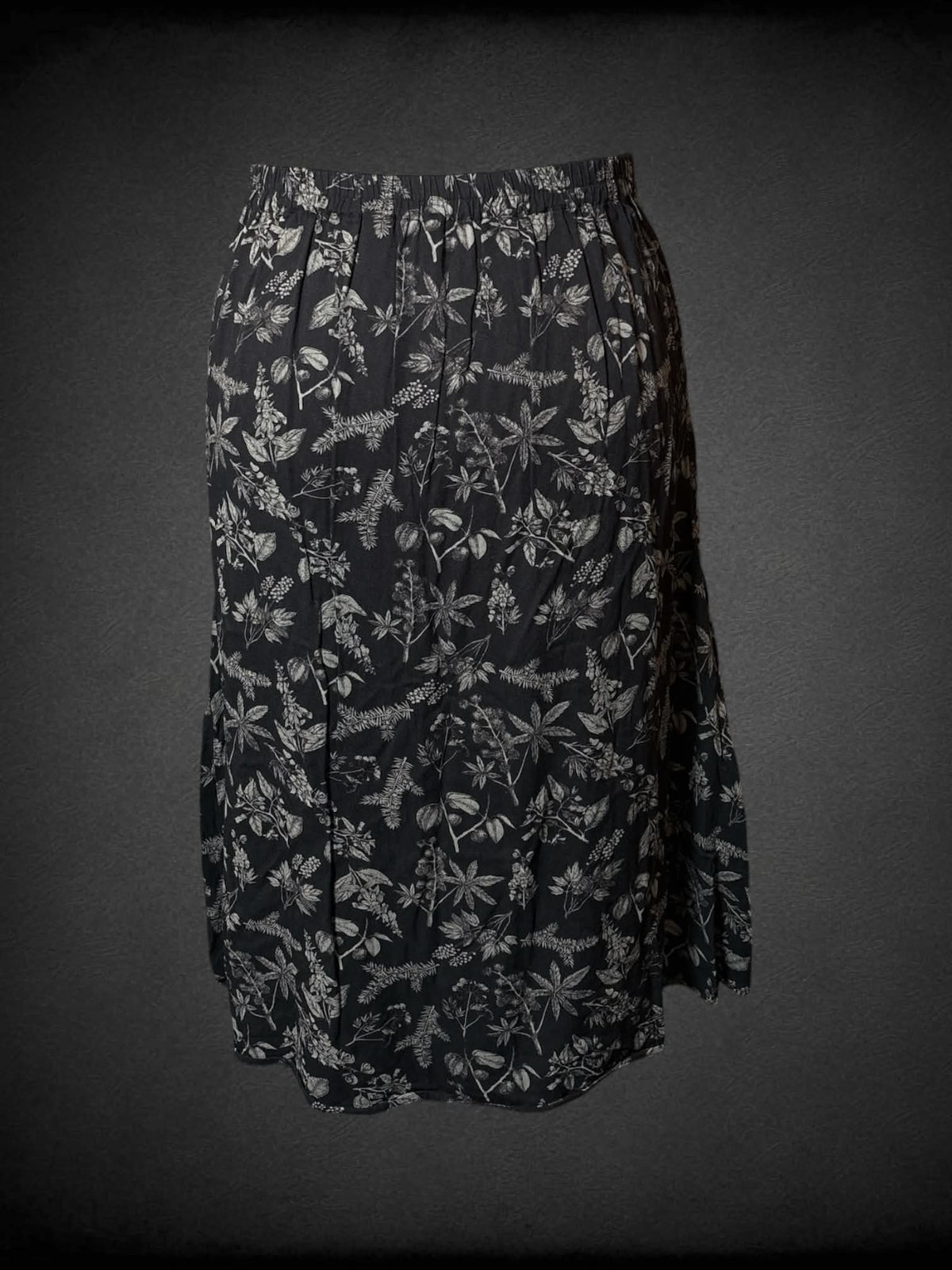 XL Disturbia black skirt with brown floral design, pockets, and stretch waist