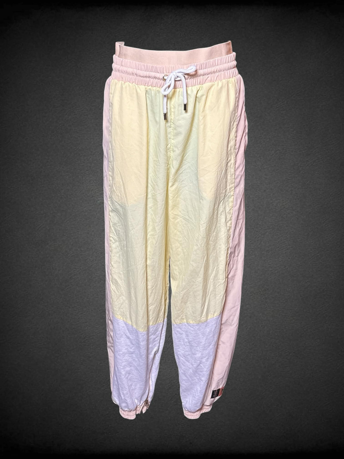 M P.E. Nation yellow semi-sheer color block windbreaker pants with stretch waist