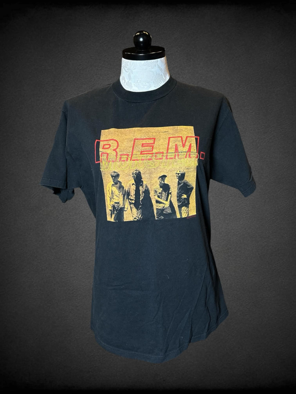 1X Nice Man black t shirt with “R.E.M. Monster” band graphic on front, and song titles graphic on back