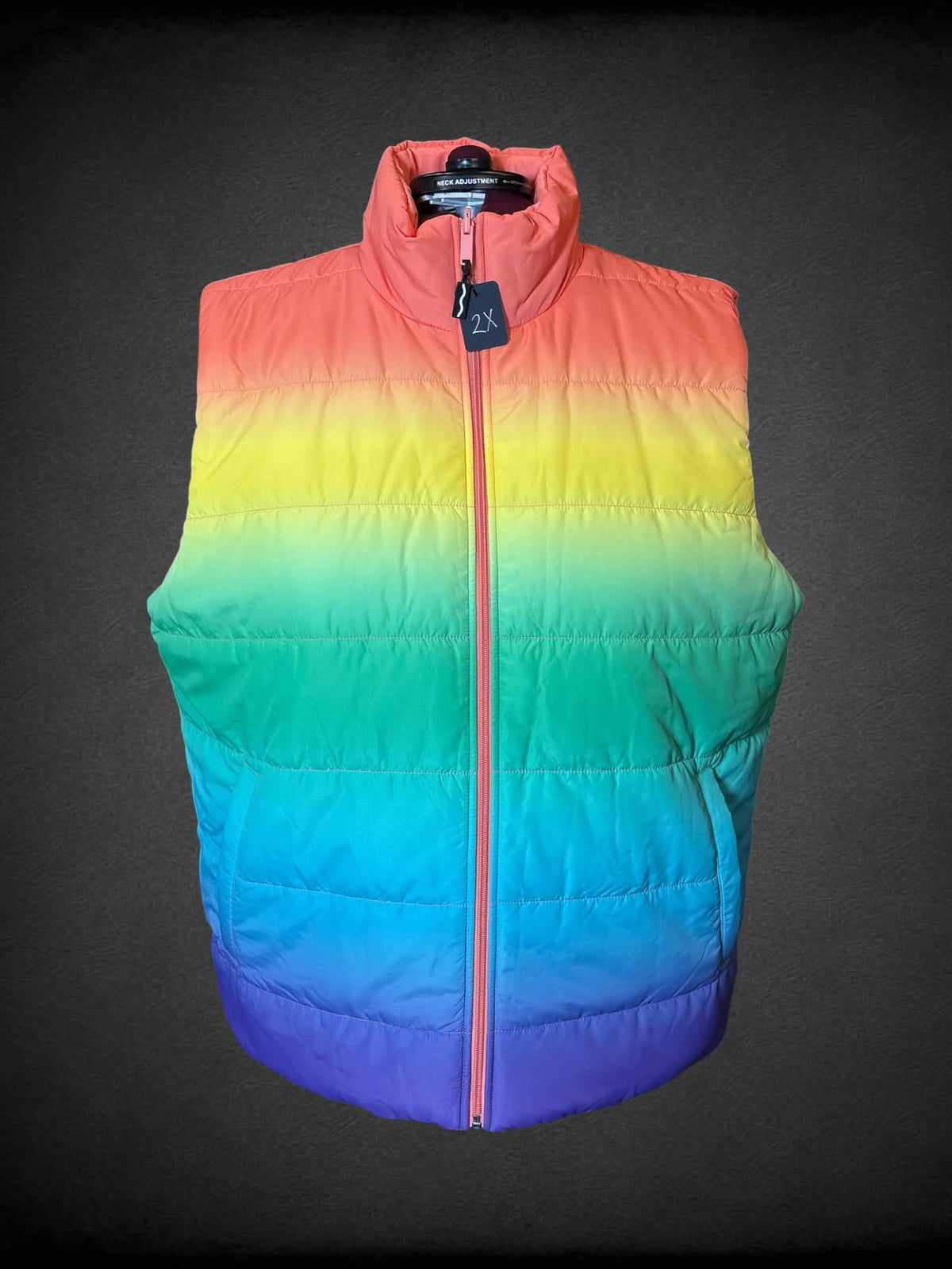 2X rainbow gradient reversible zip-up puffer vest, with peach reverse side