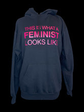 Load image into Gallery viewer, 0X Black hooded sweater w/ hot pink &quot;This is what A Feminist Looks like&quot; text
