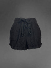 Load image into Gallery viewer, XXS Black high waisted shorts w/ elastic drawstring waist, pockets, button detail, &amp; cuffed hem
