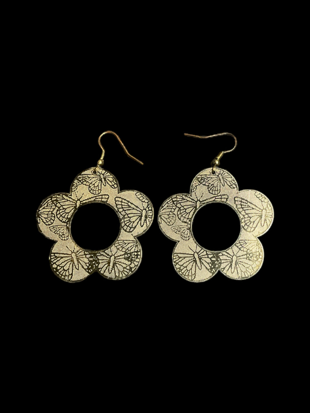 Silver like thin flower shaped earrings w/ butterfly design