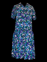 Load image into Gallery viewer, XL Vintage black, blue, purple, &amp; green floral print short sleeve button down dress w/ pleated skirt, button front, folded collar, &amp; chest pocket
