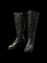Load image into Gallery viewer, 12W Black faux leather knee high wedge heeled boots w/ side zipper, elastic sides, funky interior pattern, &amp; decorative buckle
