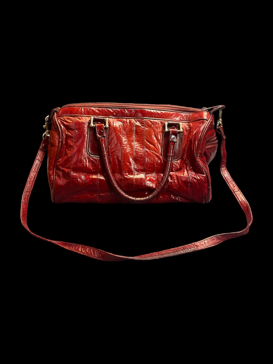 Red eel skin hand bag w/ shoulder strap, silvertone hardware, &side pockets,  internal pocket