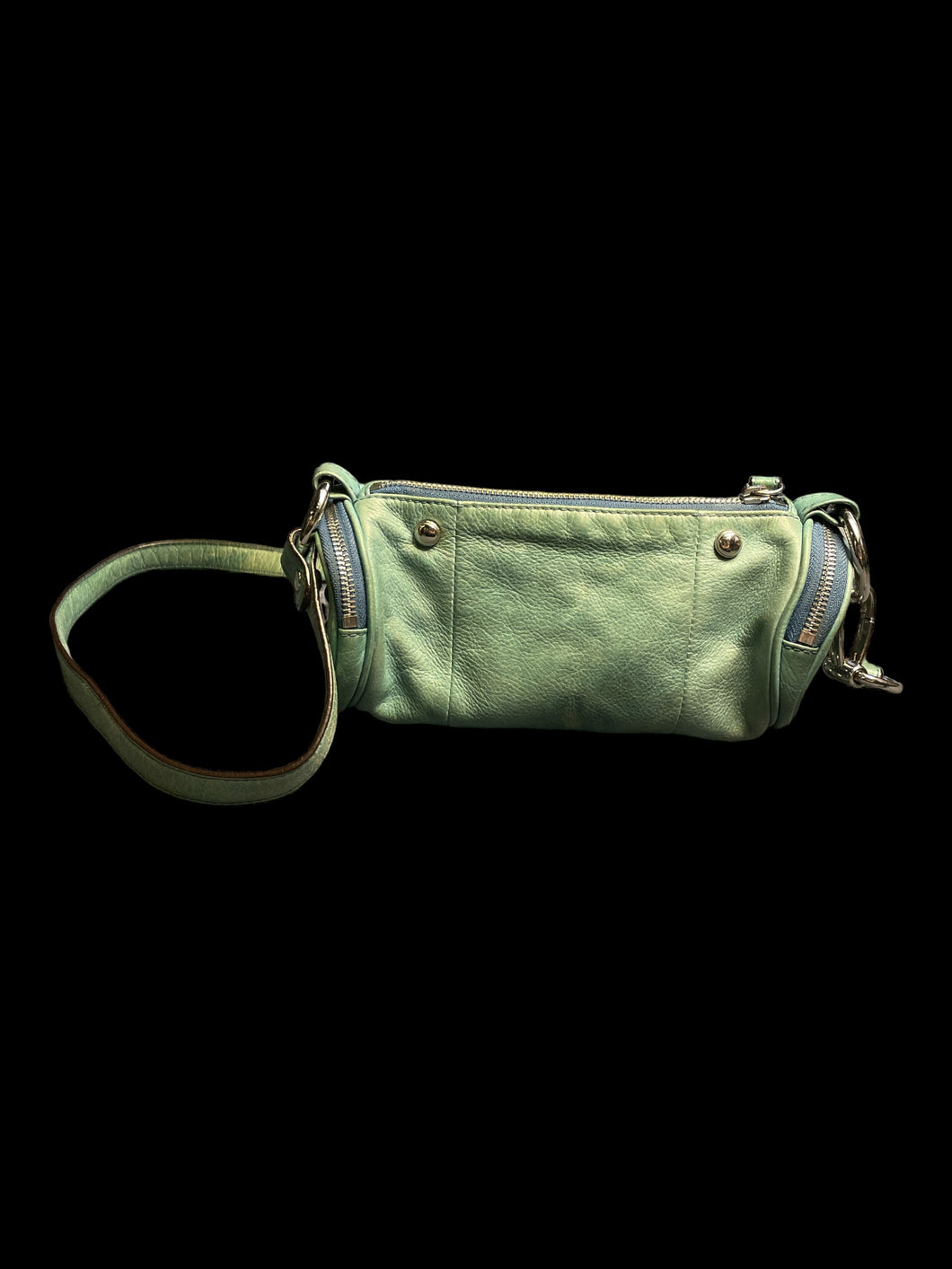 Light green leather cylindrical purse w/ metal-like stud details, strap, & inner pocket