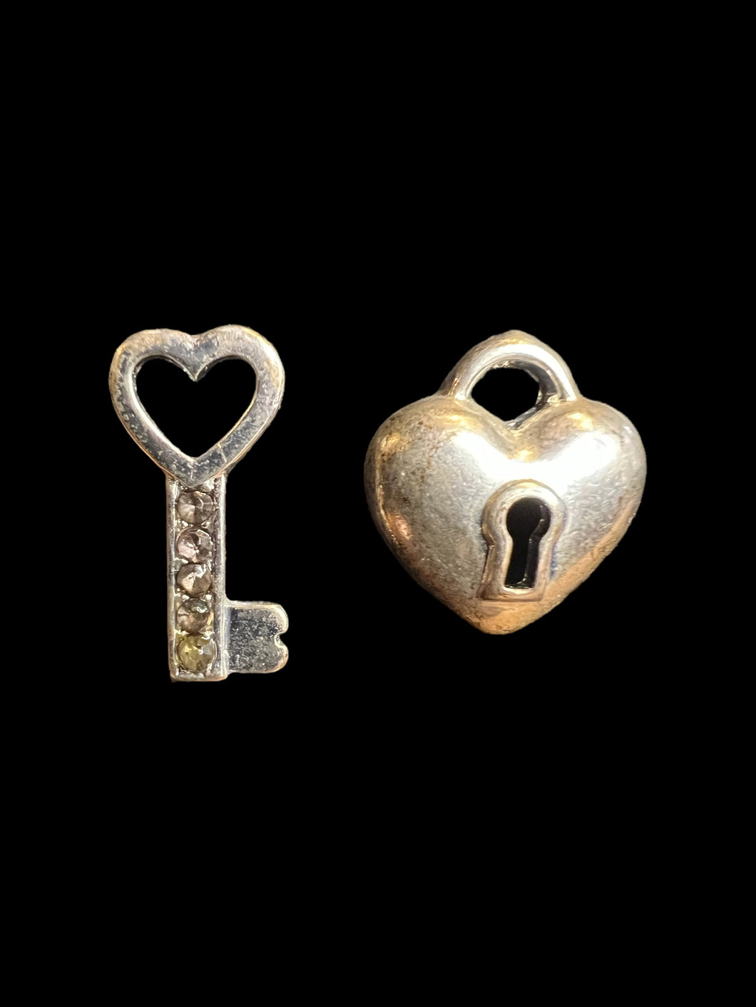 Silver-like heart lock & key earrings w/ clear cut gems, & friction back