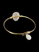 Load image into Gallery viewer, Gold like wire bracelet w black skull shaped gem, white gem outline, &amp; hook/loop closure
