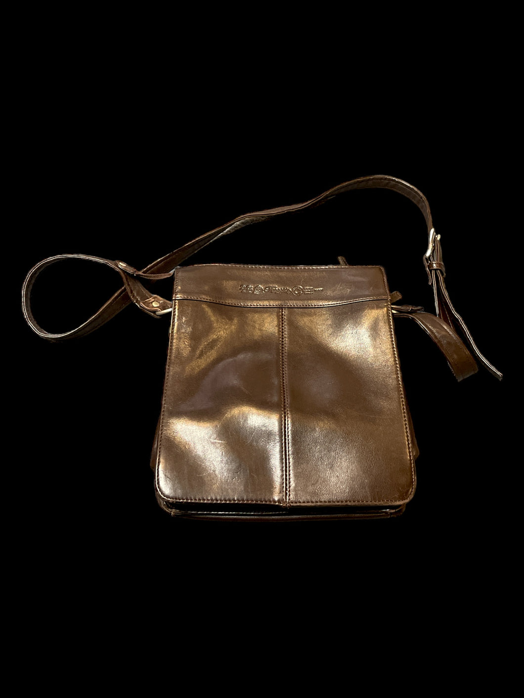 Rich brown leather crossbody bag w/ silver-like hardware, buckle adjustable strap, zipper pockets, & inner pockets