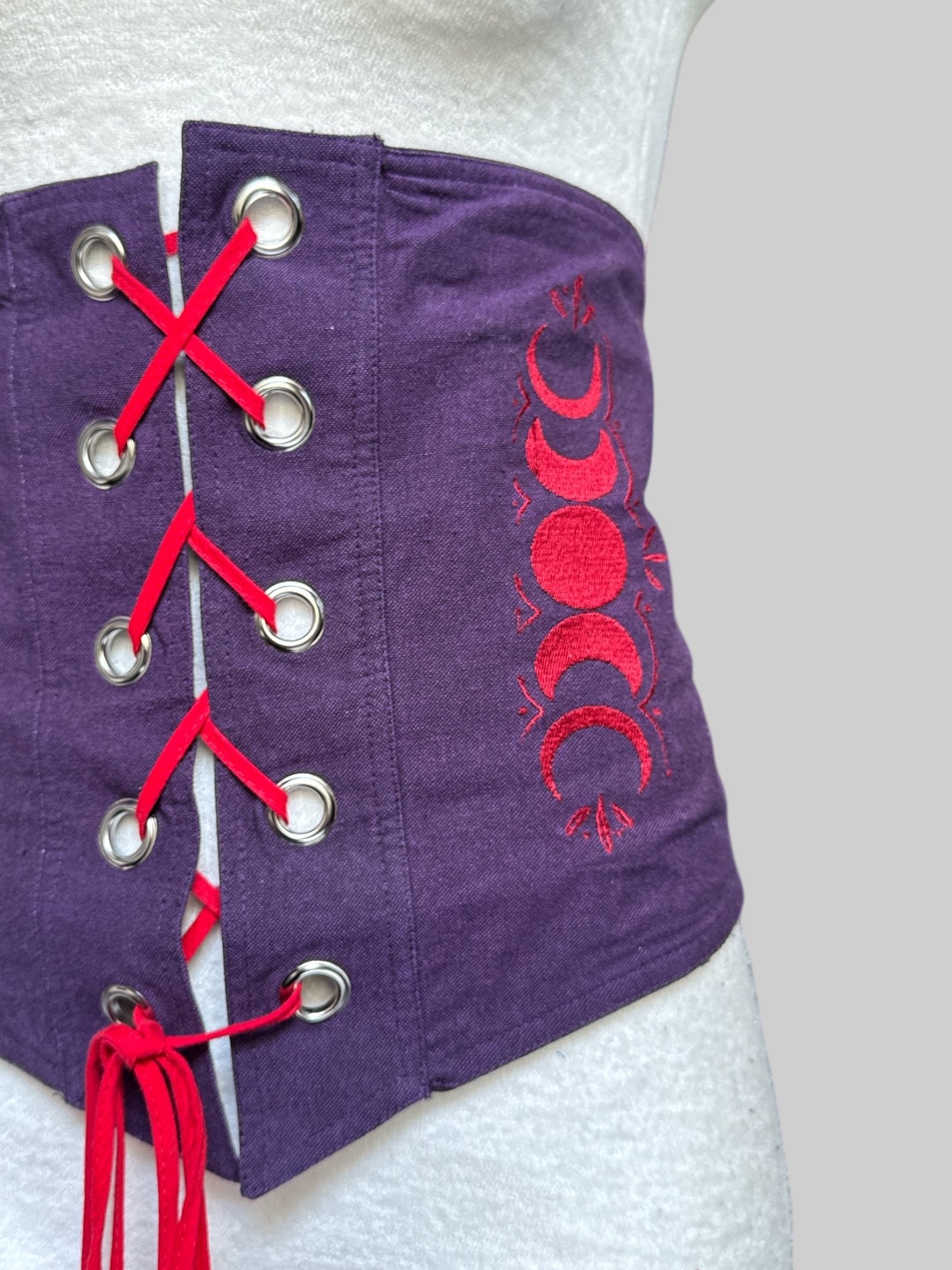 1X purple corset with red embroidery and lace