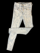 Load image into Gallery viewer, XS Light blue distressed denim pants w/ skinny legs, pockets, &amp; button/zipper closure
