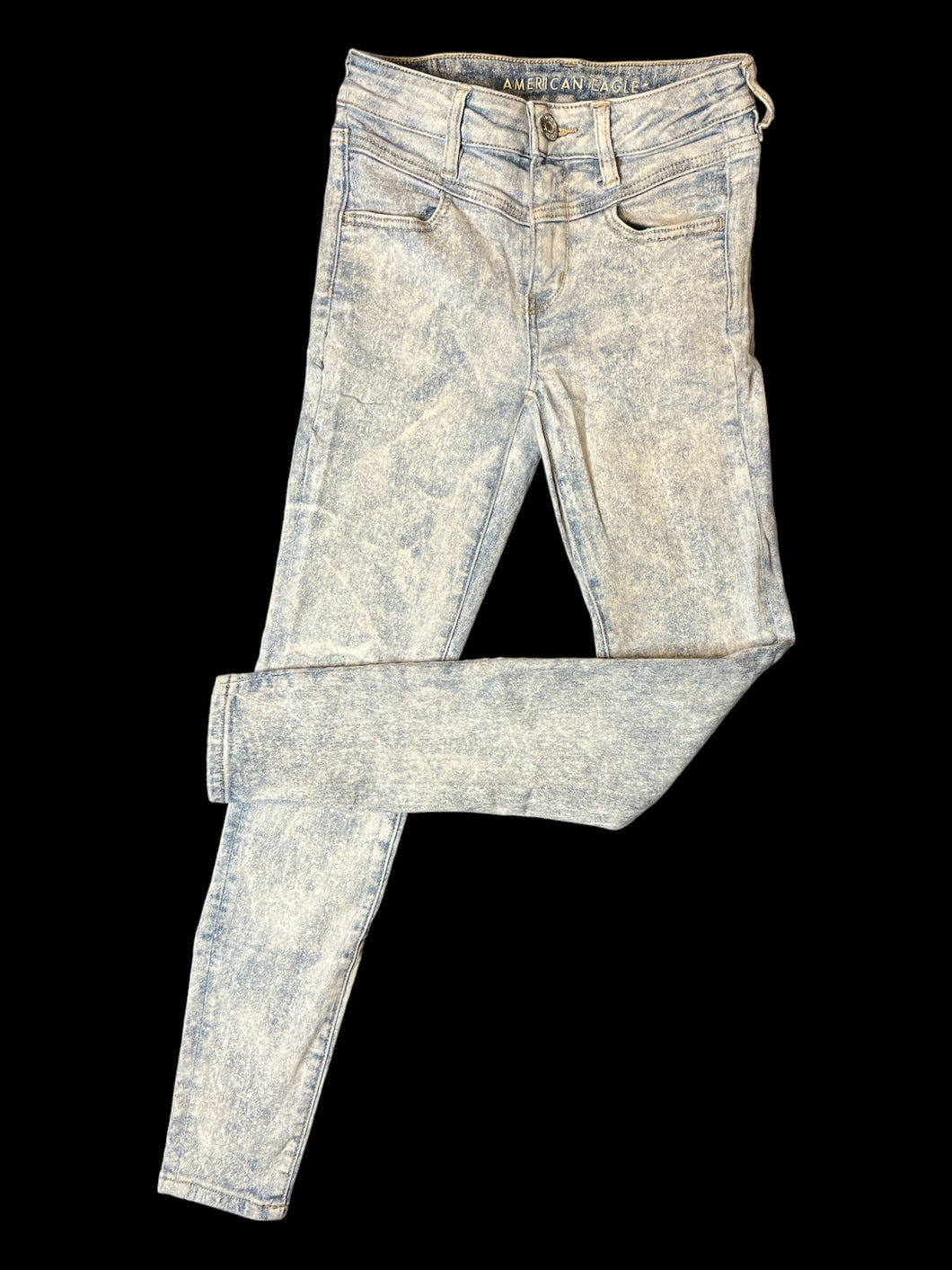 XS Light blue distressed denim pants w/ skinny legs, pockets, & button/zipper closure