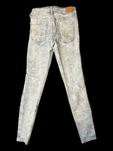 Load image into Gallery viewer, XS Light blue distressed denim pants w/ skinny legs, pockets, &amp; button/zipper closure
