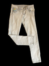 Load image into Gallery viewer, M Light denim skinny jeans w/ embroidered stylized back pockets, bedazzled logo on back, faceted bejeweled studs, &amp; double button/zipper closure
