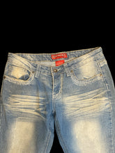 Load image into Gallery viewer, M Blue distressed jeans w/ light wash along legs front &amp; back, gold &amp; white ornate stitching on back pockets , faux whiskers, &amp; zipper button closure
