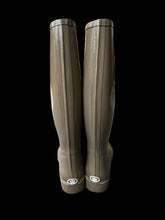 Load image into Gallery viewer, 7 Light brown rain boots w/ large Juicy Couture logo on side, &amp; small logo on heel
