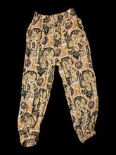 Load image into Gallery viewer, M Black balloon leg pants w/ multicolor ornate pattern, mock buttons, pockets, &amp; elastic waistband
