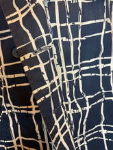 Load image into Gallery viewer, S Blue double breasted jacket w/ white stylized line design, matching belt, pockets, &amp; orange &amp; white polka dot interior
